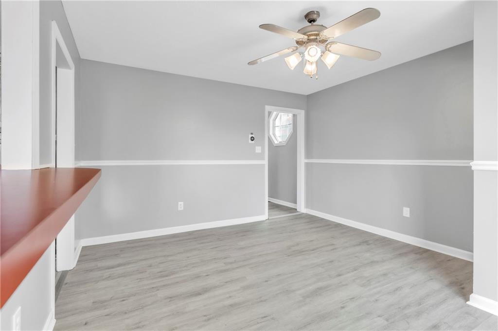 530 Griffin Street Pittsburgh, PA 15211 - Photo 10 of 41 a view of an empty room with window and a chandelier fan
