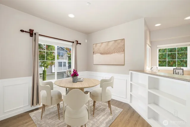 a dining room with furniture and window