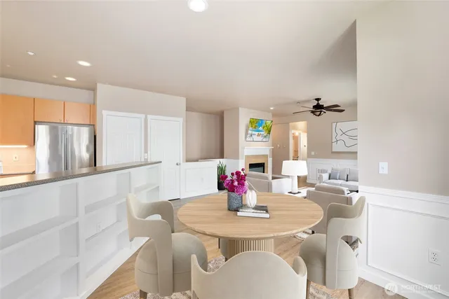 a kitchen with kitchen island a sink table and chairs