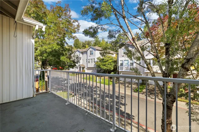 a view of a balcony with trees