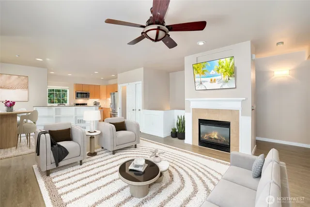 a living room with furniture and a fireplace