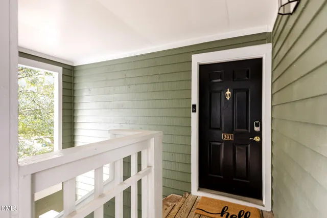 a picture of a bench in front of a wall