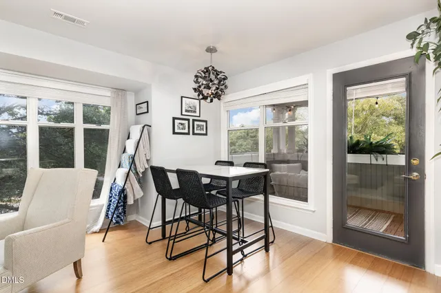a living room with stainless steel appliances kitchen island granite countertop furniture and a kitchen view