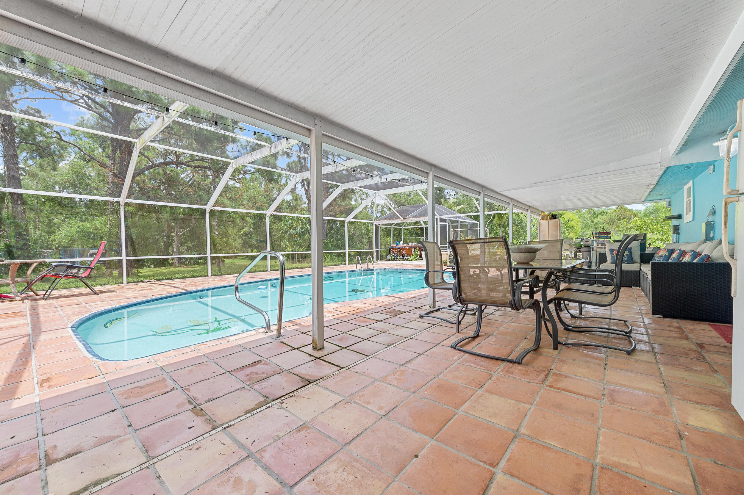 12450 77th Street Fellsmere, FL 32948 - Photo 29 of 44 a view of a swimming pool with outdoor seating