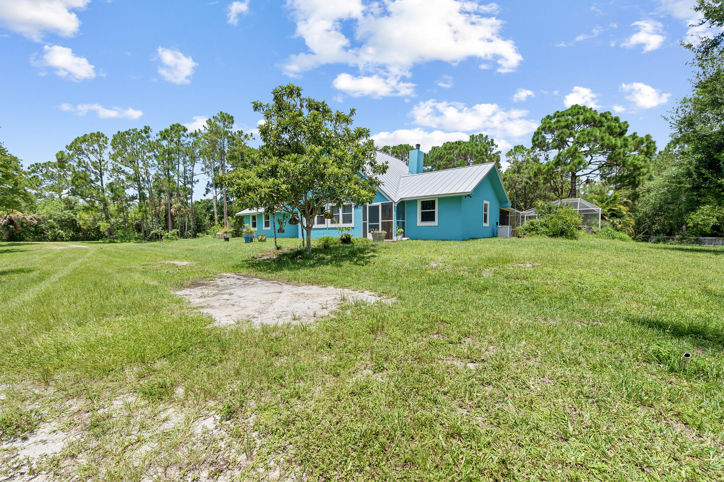 12450 77th Street Fellsmere, FL 32948 - Photo 5 of 44 a view of a house with a yard