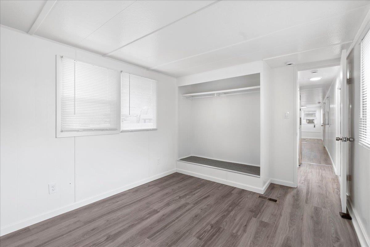 1525 Cold Springs Road, Unit 82 Placerville, CA 95667 - Photo 13 of 20 an empty room with wooden floor and windows