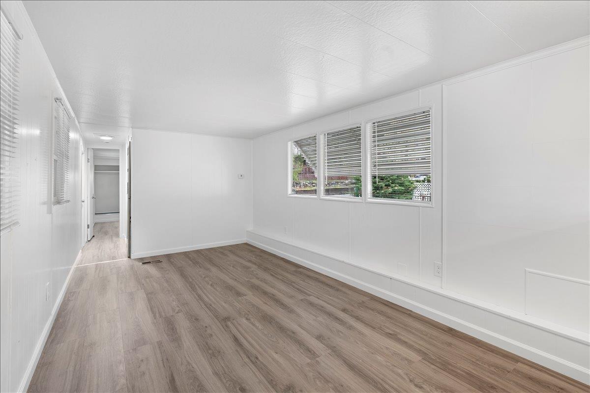1525 Cold Springs Road, Unit 82 Placerville, CA 95667 - Photo 9 of 20 an empty room with wooden floor and windows