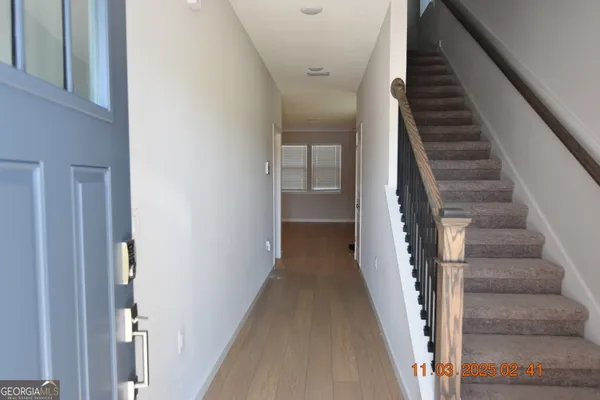 a view of a hallway with staircase