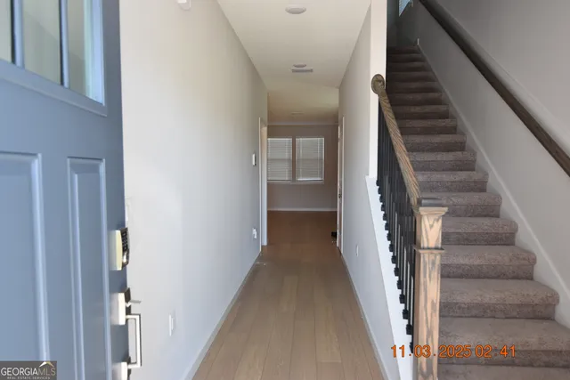 a view of a hallway with staircase