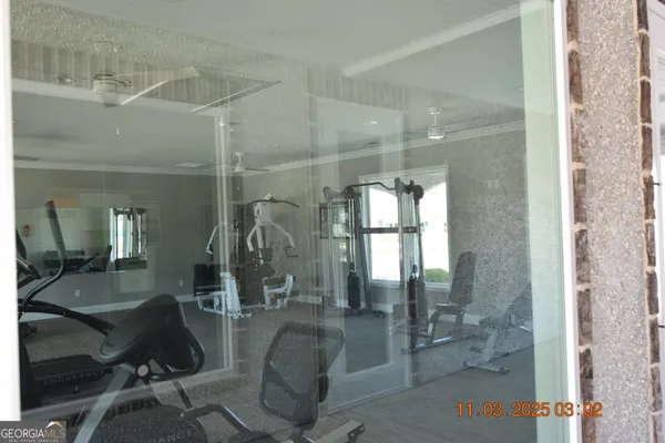 a lobby with a glass door shower and couches