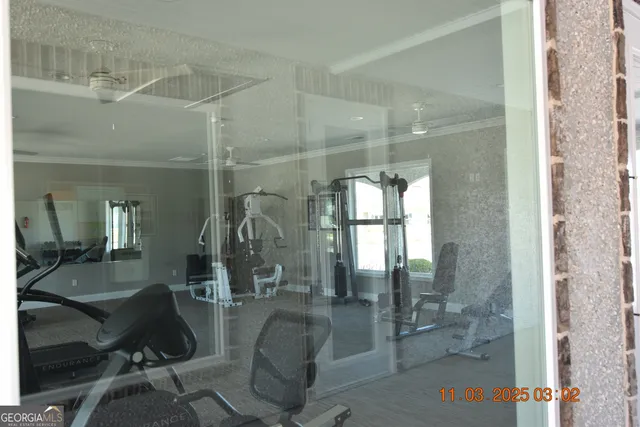 a lobby with a glass door shower and couches