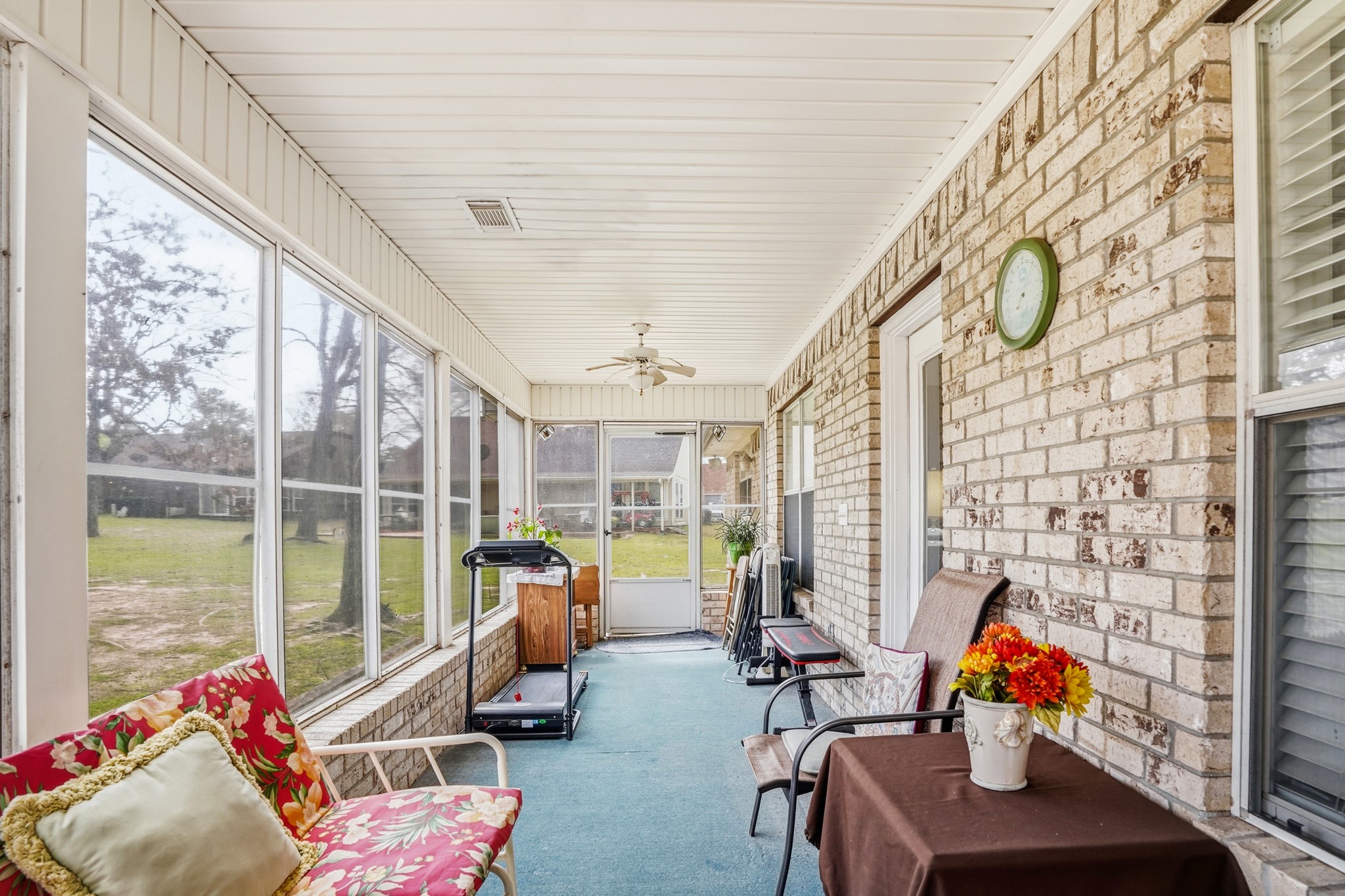 281 Broadmoor Street Trinity, TX 75862 - Photo 15 of 19 a living room with furniture and a floor to ceiling window