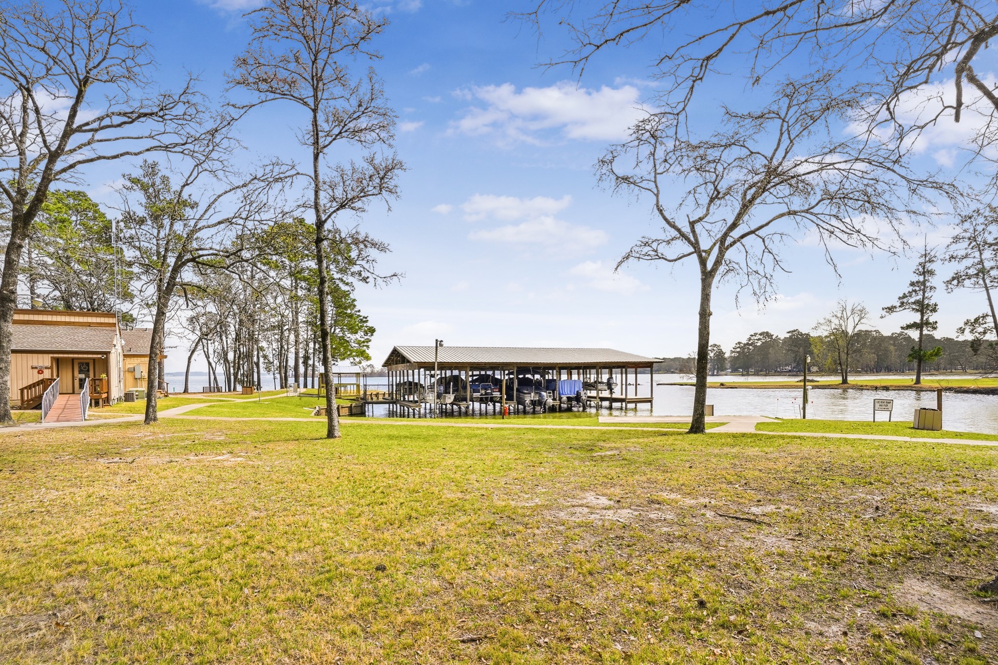 281 Broadmoor Street Trinity, TX 75862 - Photo 16 of 19 a view of a swimming pool with an outdoor space and seating area