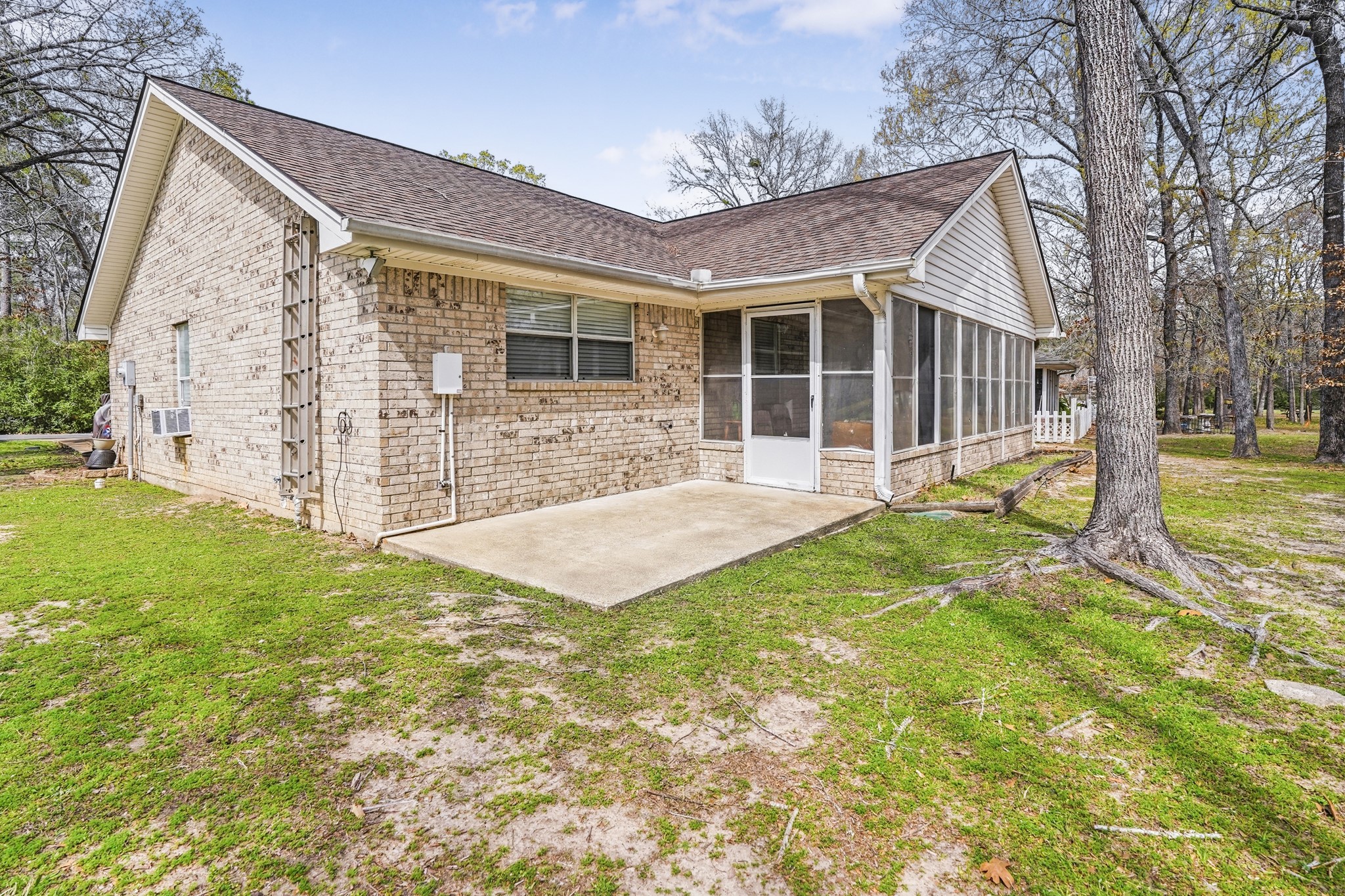 281 Broadmoor Street Trinity, TX 75862 - Photo 2 of 19 a view of a house with a yard and sitting area