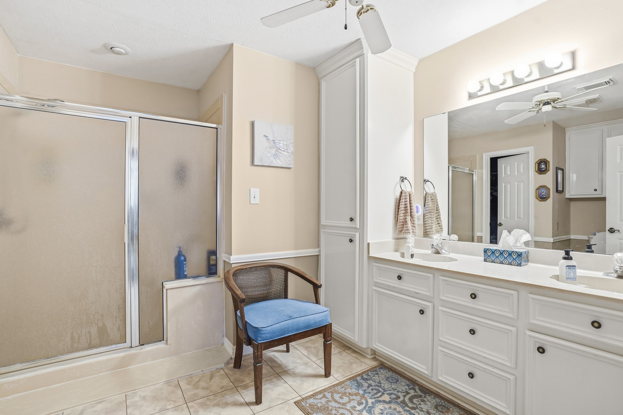 281 Broadmoor Street Trinity, TX 75862 - Photo 7 of 19 a spacious bathroom with a double vanity sink a mirror and a shower