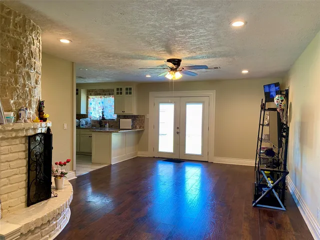 a view of a room with gym equipment and a large window