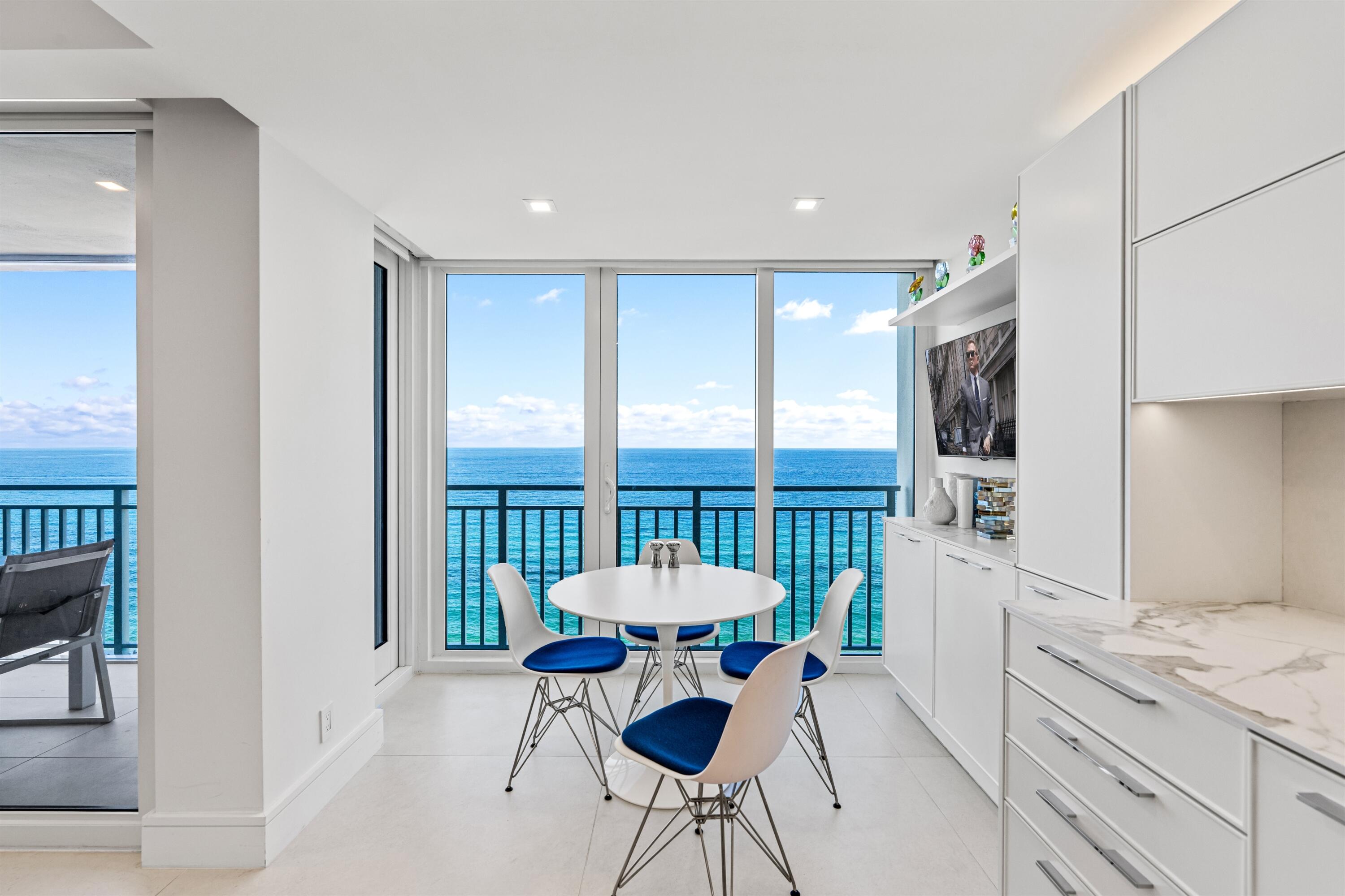 2600 South Ocean Boulevard, Unit 19E Boca Raton, FL 33432 - Photo 14 of 53 a kitchen with a table and chairs