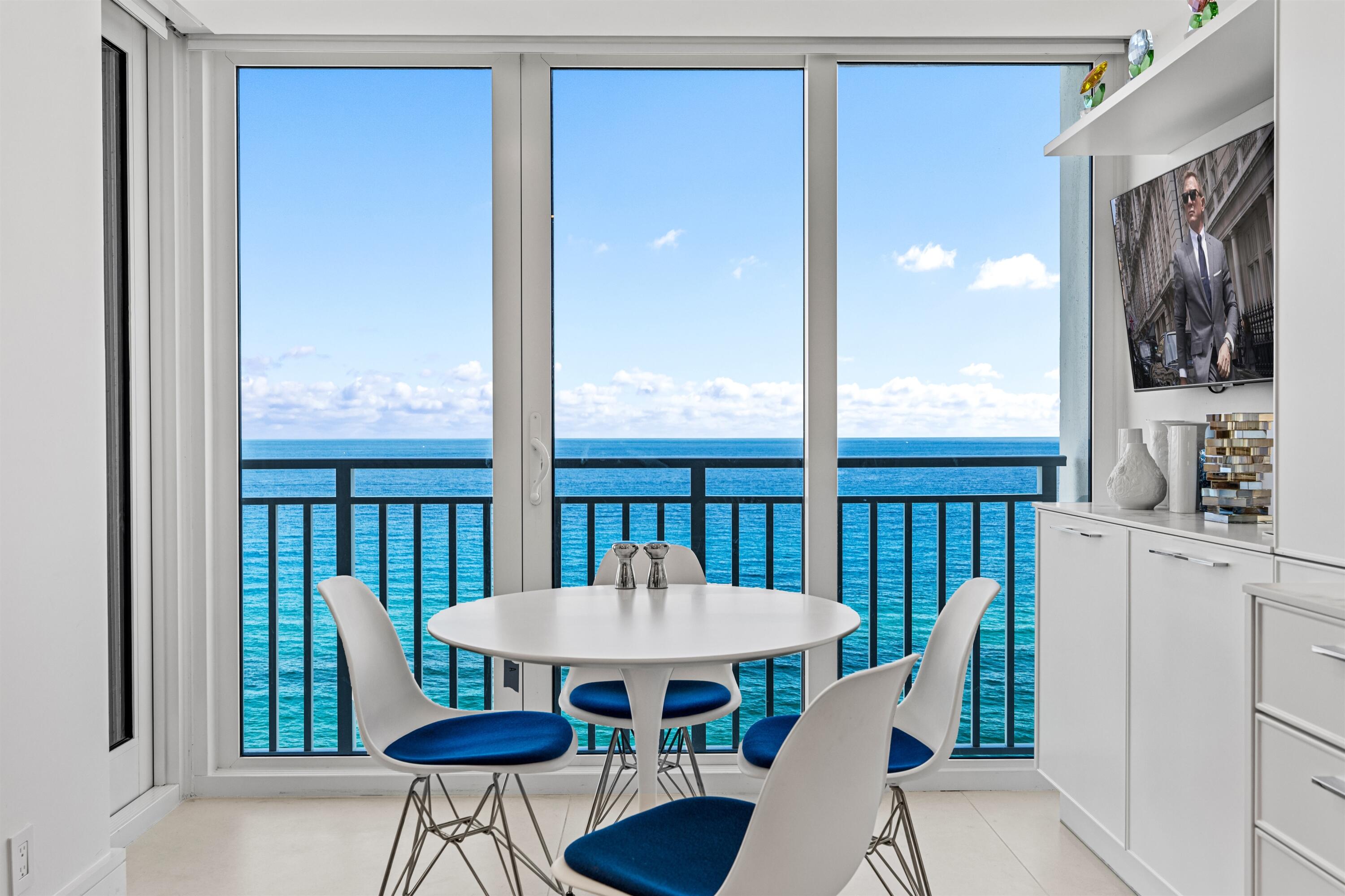 2600 South Ocean Boulevard, Unit 19E Boca Raton, FL 33432 - Photo 15 of 53 a view of a dining room with furniture window and wooden floor