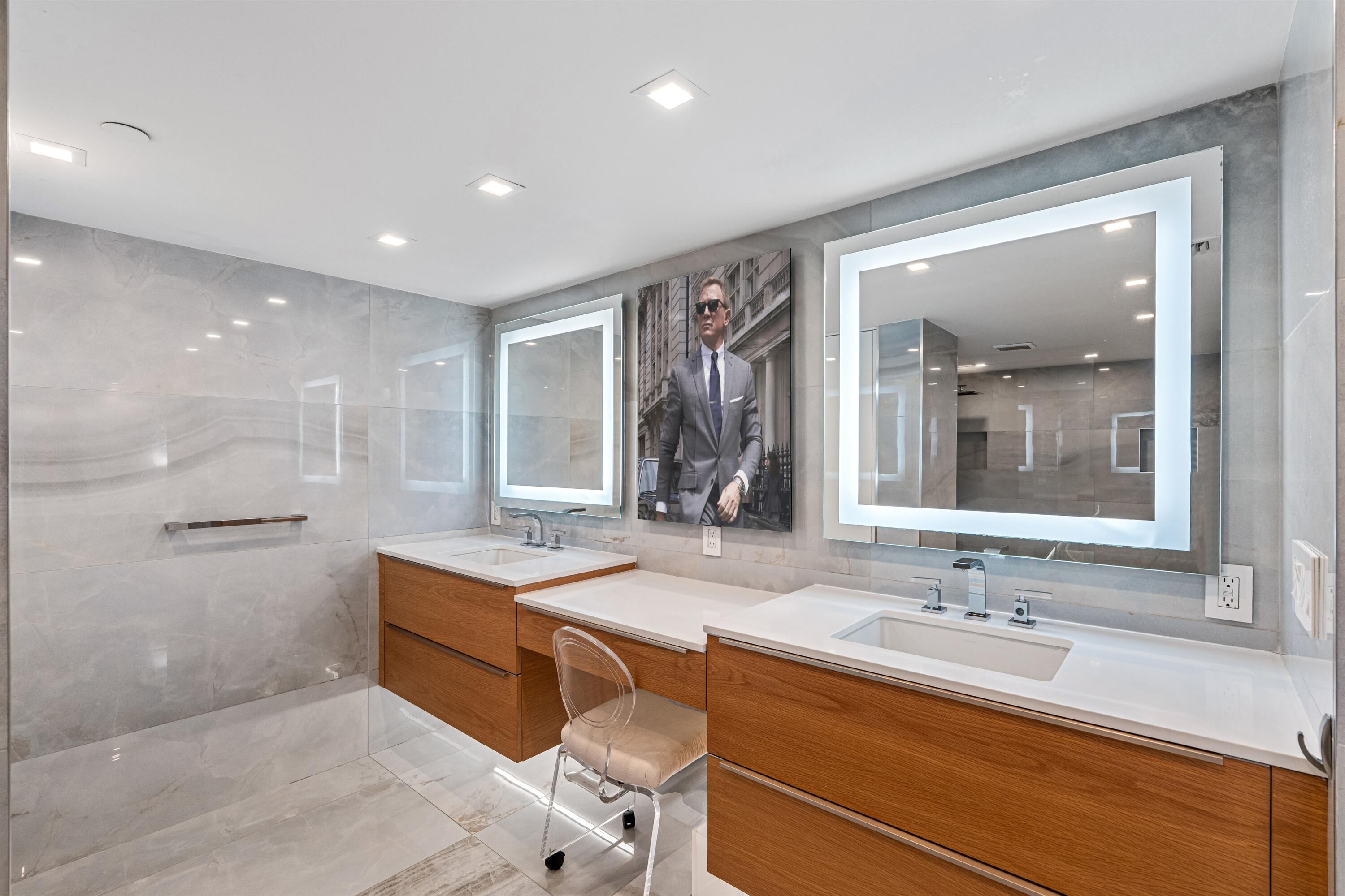 2600 South Ocean Boulevard, Unit 19E Boca Raton, FL 33432 - Photo 20 of 53 a bathroom with a sink double vanity and a mirror