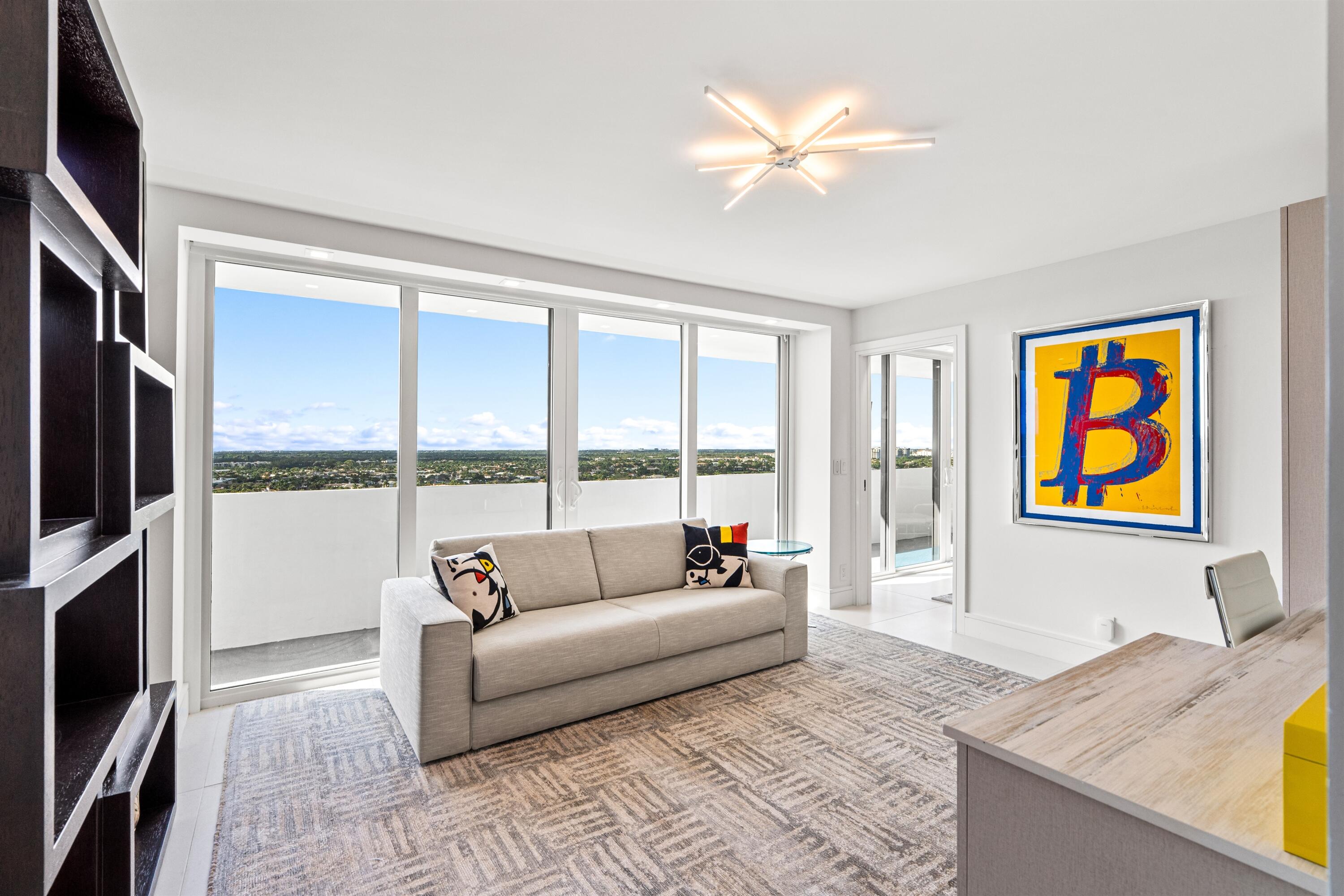 2600 South Ocean Boulevard, Unit 19E Boca Raton, FL 33432 - Photo 26 of 53 a living room with fireplace furniture and a flat screen tv