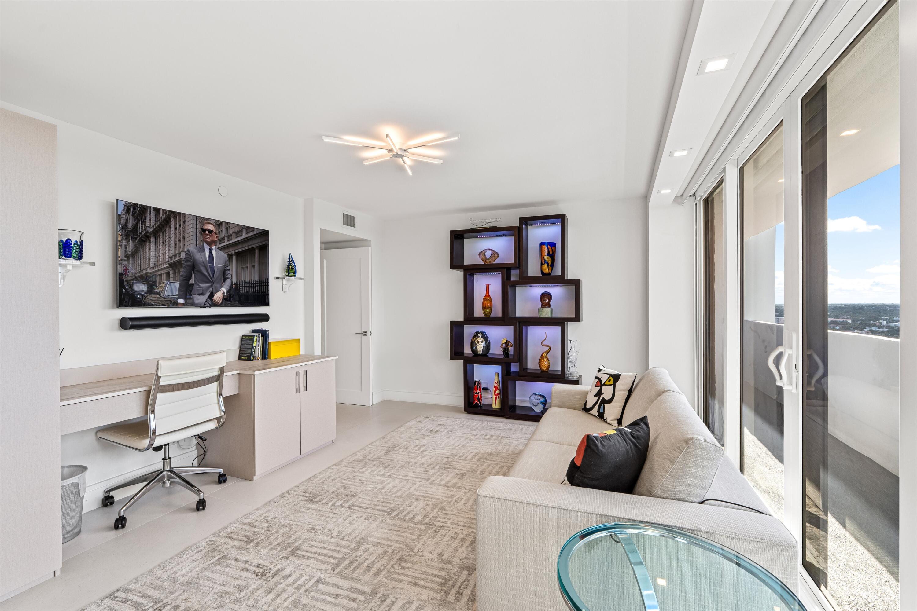 2600 South Ocean Boulevard, Unit 19E Boca Raton, FL 33432 - Photo 27 of 53 a living room with furniture a rug and a window
