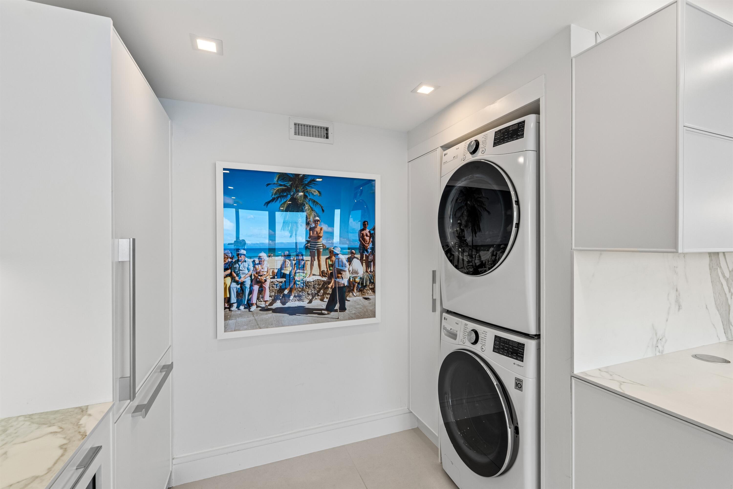 2600 South Ocean Boulevard, Unit 19E Boca Raton, FL 33432 - Photo 29 of 53 a view of a hallway with washer and dryer