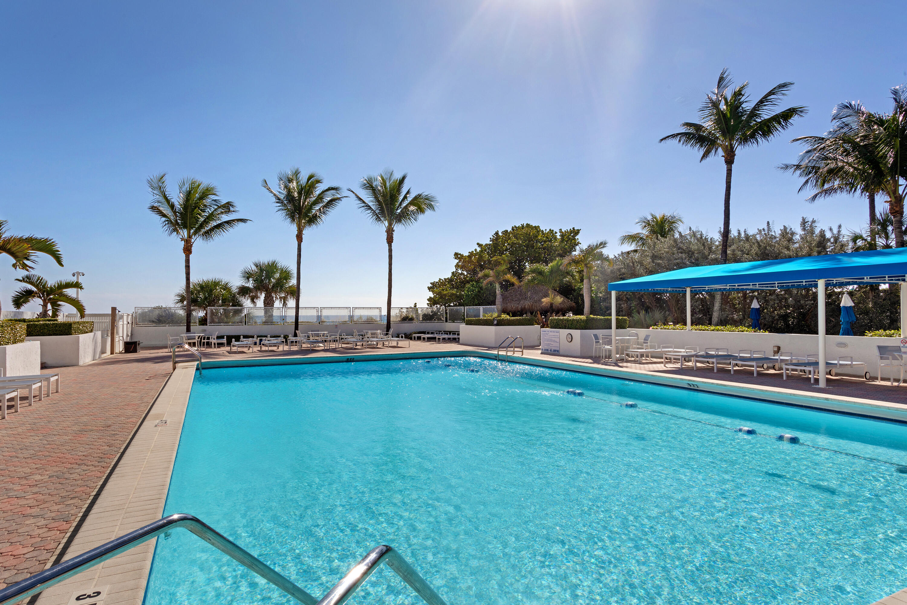 2600 South Ocean Boulevard, Unit 19E Boca Raton, FL 33432 - Photo 49 of 53 a view of a swimming pool and a chair