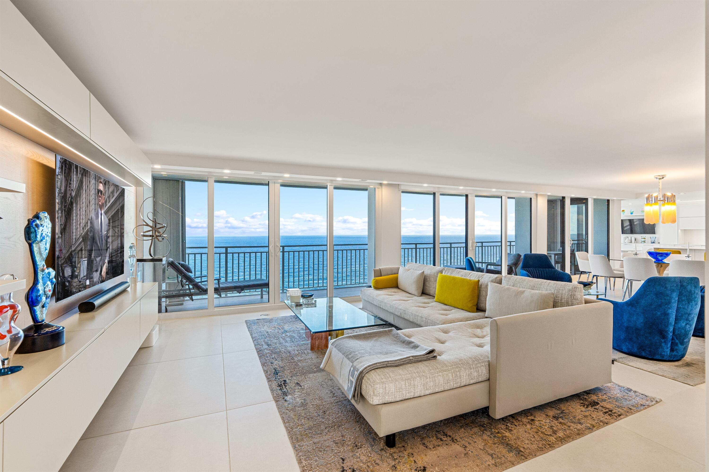 2600 South Ocean Boulevard, Unit 19E Boca Raton, FL 33432 - Photo 6 of 53 a living room with furniture and a flat screen tv