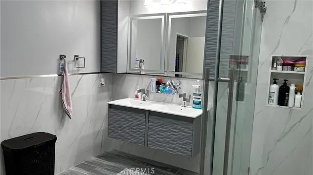 a bathroom with a sink and a mirror