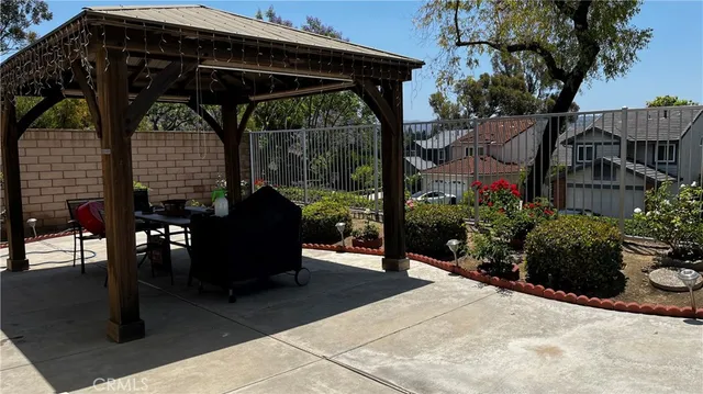 a view of a chairs and table in the patio