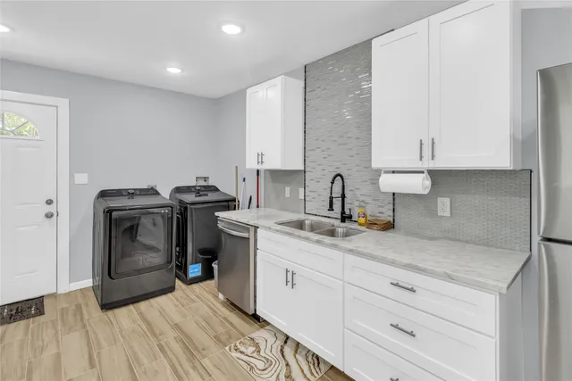 a kitchen with a stove and a sink