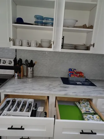 a kitchen with stainless steel appliances a refrigerator stove and sink