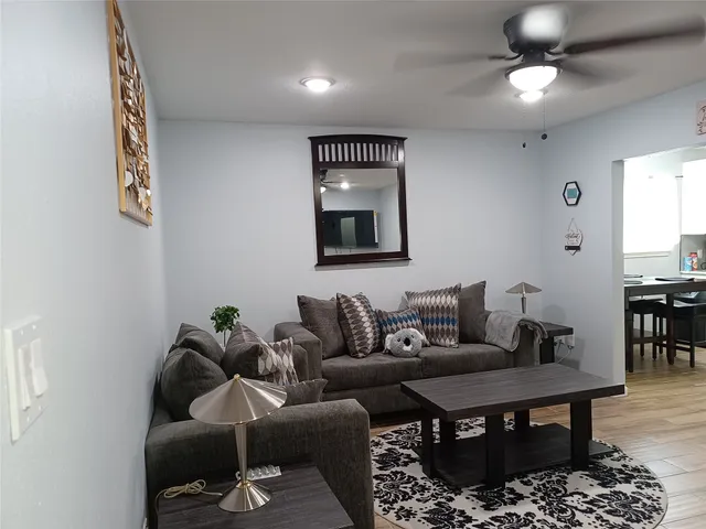 a living room with furniture and a rug