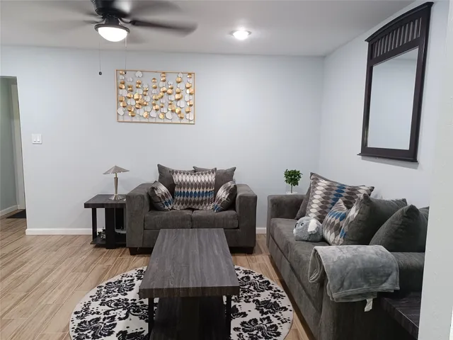a view of a dining room with furniture and wooden floor