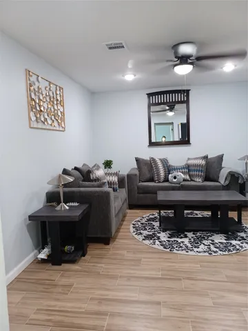 a bathroom with a black white checkered floor