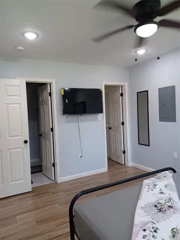 a living room with furniture and a painting on the wall