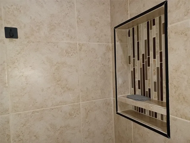 a kitchen with a microwave a stove and cabinets