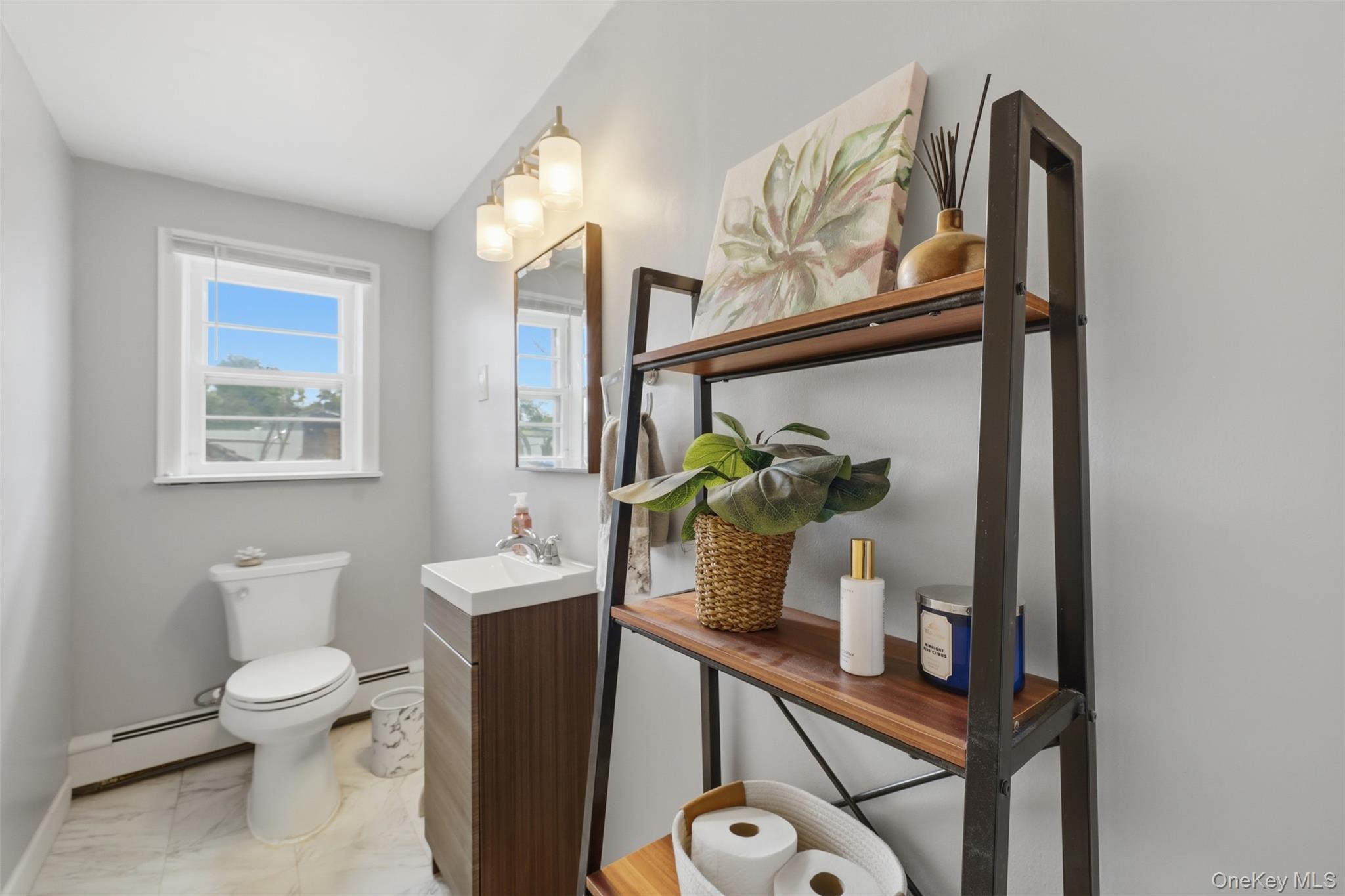 24 Beatty Road Wappingers Falls, NY 12590 - Photo 23 of 36 a bathroom with a toilet sink and mirror