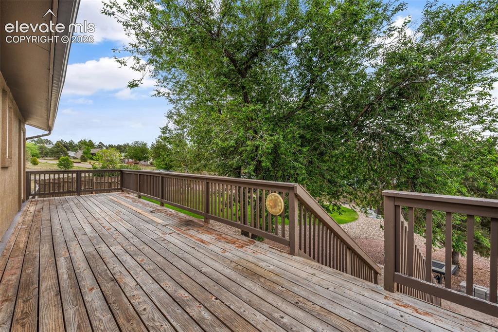 125 Diamond E Road Fountain, CO 80817 - Photo 29 of 43 a view of balcony with wooden floor and fence