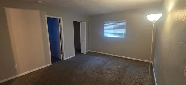 a white toilet sitting next to a bath tub