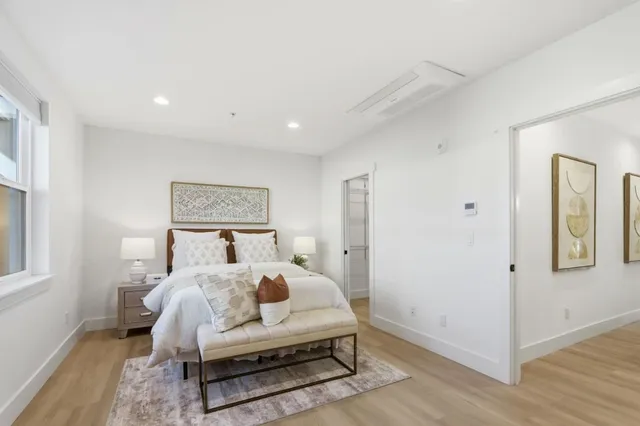 a bed room with a bed and a window