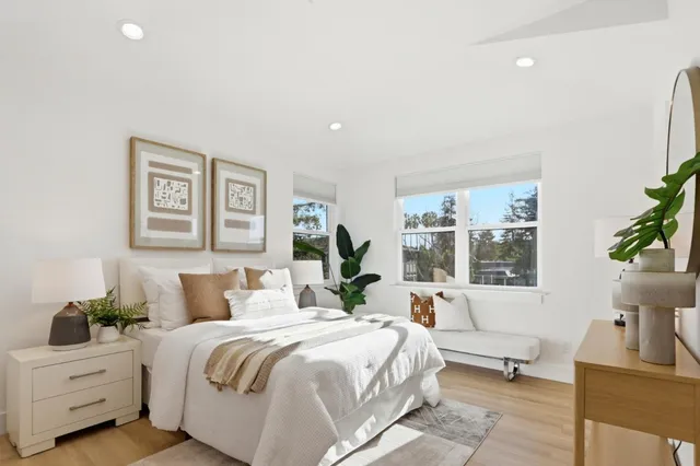 a bedroom with a large bed and a couch