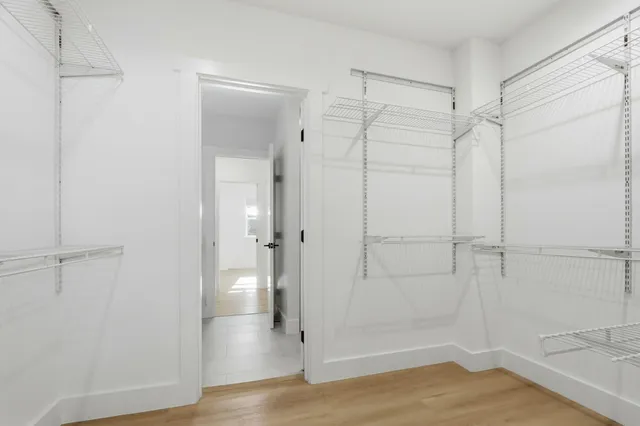 a bathroom with a shower and a glass door