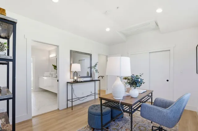 a living room with furniture and a table