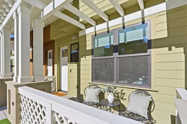 a bathroom with a granite countertop tub and sink