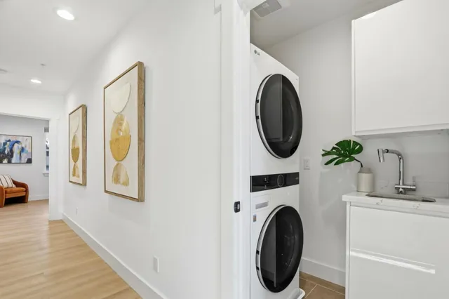a view of a hallway with washer and dryer