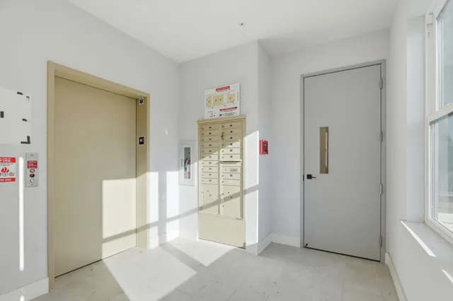 a front view of a building with outdoor seating