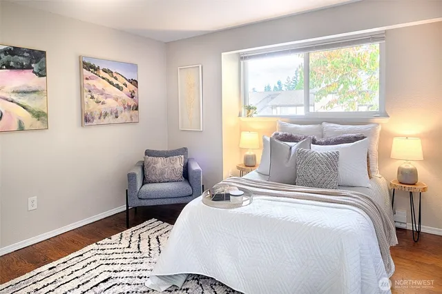 a view of a bedroom with bed and furniture
