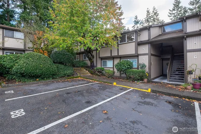 a view of a house with a yard and plants