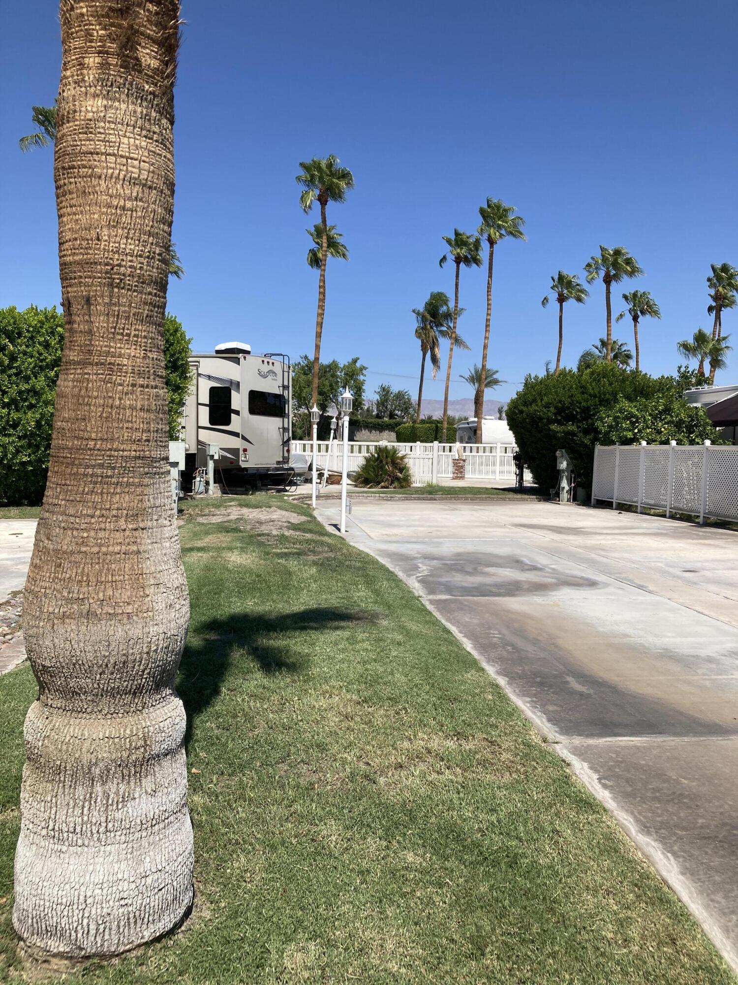 69411 Ramon Road, Unit 65 Cathedral City, CA 92234 - Photo 4 of 6 a view of a house with a patio